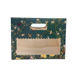 Decorative box with floral patterns and a window on a white background