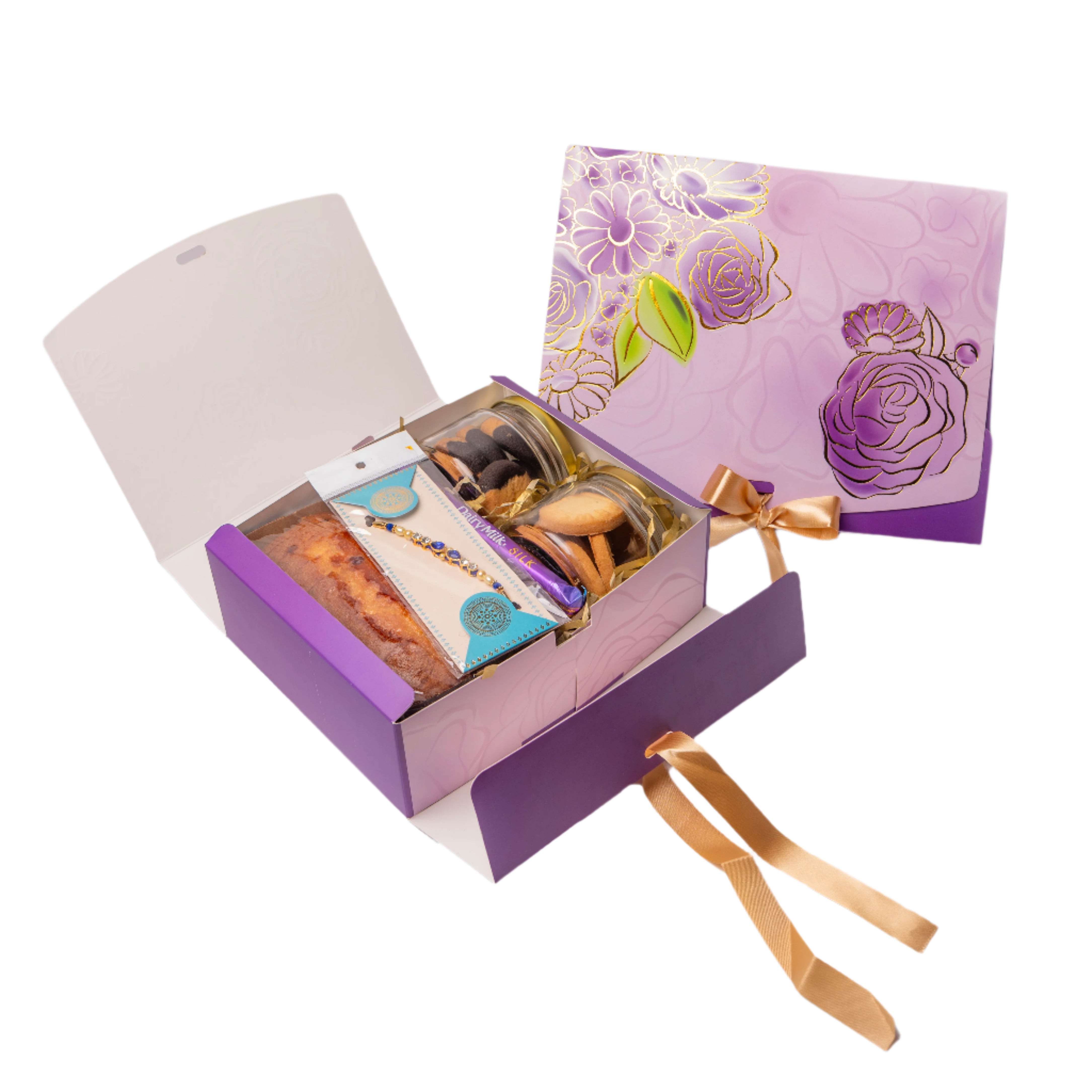 Open purple gift box with floral design on the lid, containing cookies and a card.