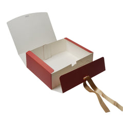 Red and white box with a gold ribbon on a white background