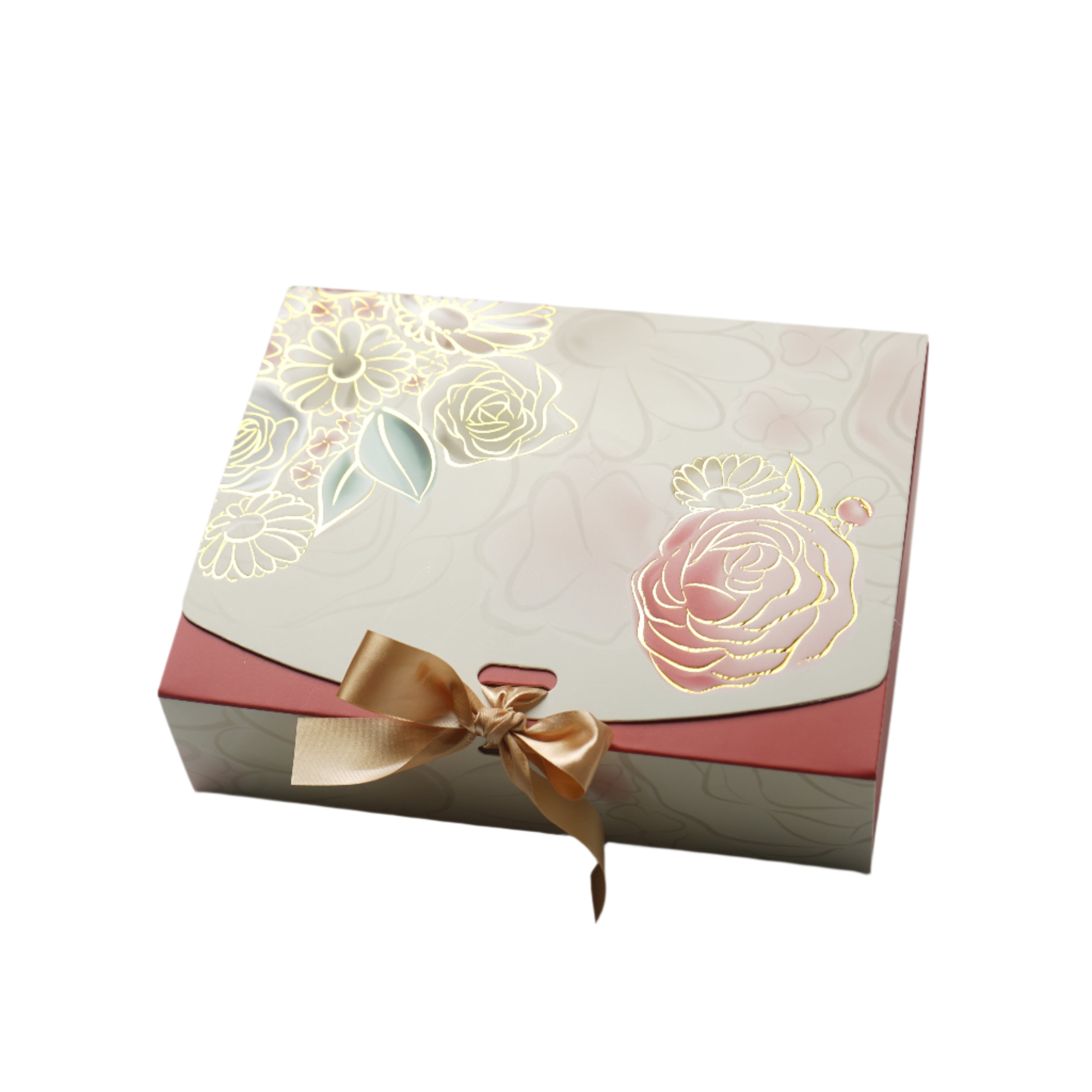 Decorative gift box with floral designs and a gold bow on a white background