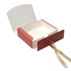 Modern wall light fixture with red and beige design on a white background