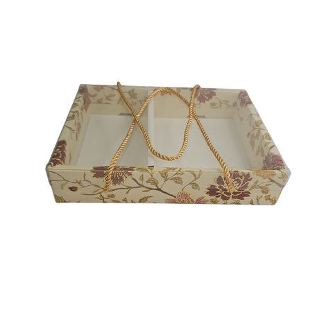 Decorative cardboard box with floral pattern and handle on a white background