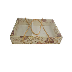 Decorative cardboard box with floral pattern and handle on a white background