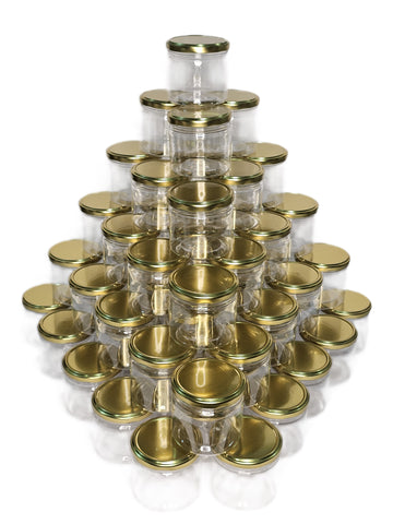 Pyramid of clear PLASTIC PET jars with gold lids on a white background