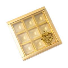 9 Cavity Chocolate Box With Golden Tray And Translucent PVC Sleeves (14*14*3 Cm) (CK-2)